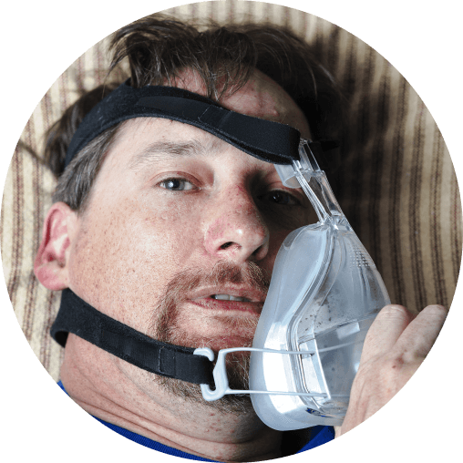 Patient struggling to tolerate a CPAP mask for sleep apnea treatment